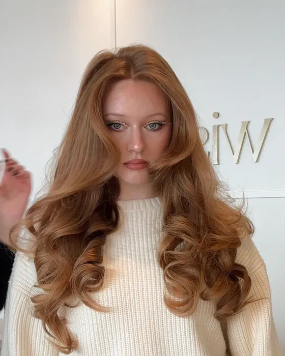 Long copper hair styled with big bouncy volume at Wish Dry Bar