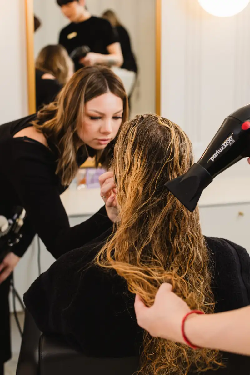 Freshly washed hair being dried at the start of a treatment appointment