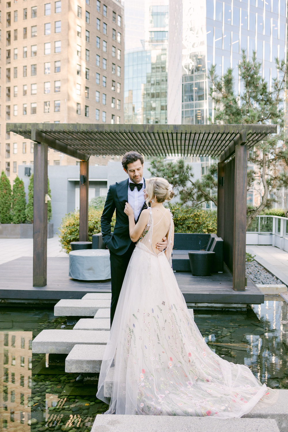 Professional bridal hair service with romantic styling and fresh flowers