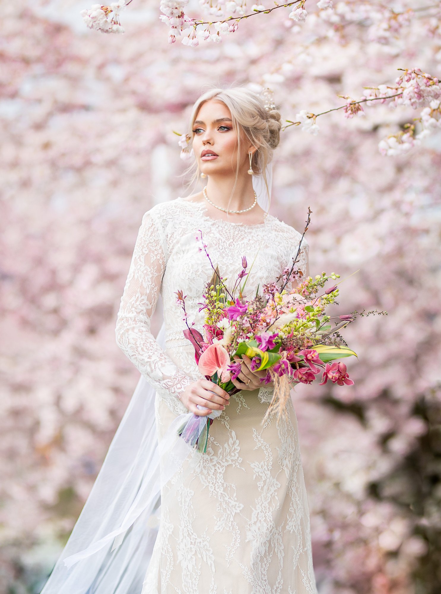 Elegant bridal hairstyle with pearl accessories and loose curls for special day