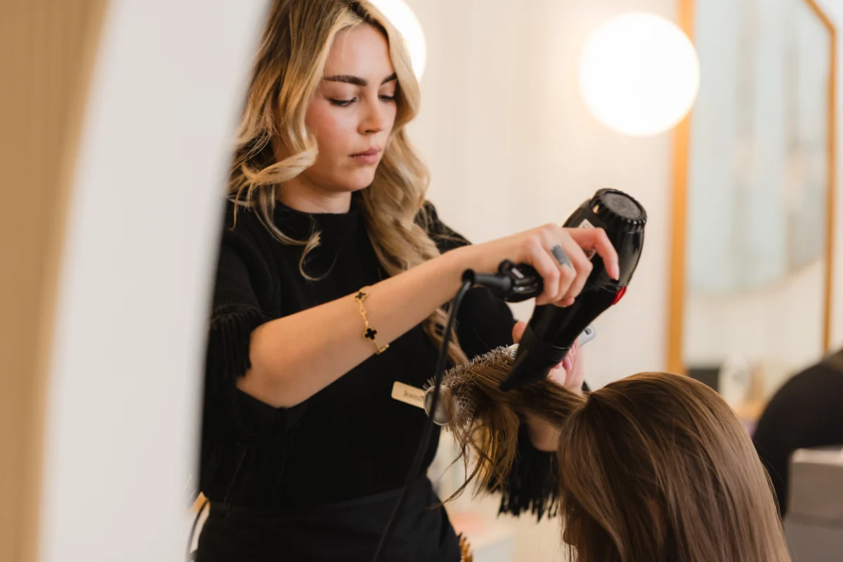 Stylist blow-drying a client at Wish Dry Bar