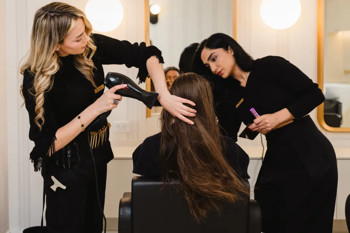 Hair and makeup team preparing a client at Wish Dry Bar Vancouver