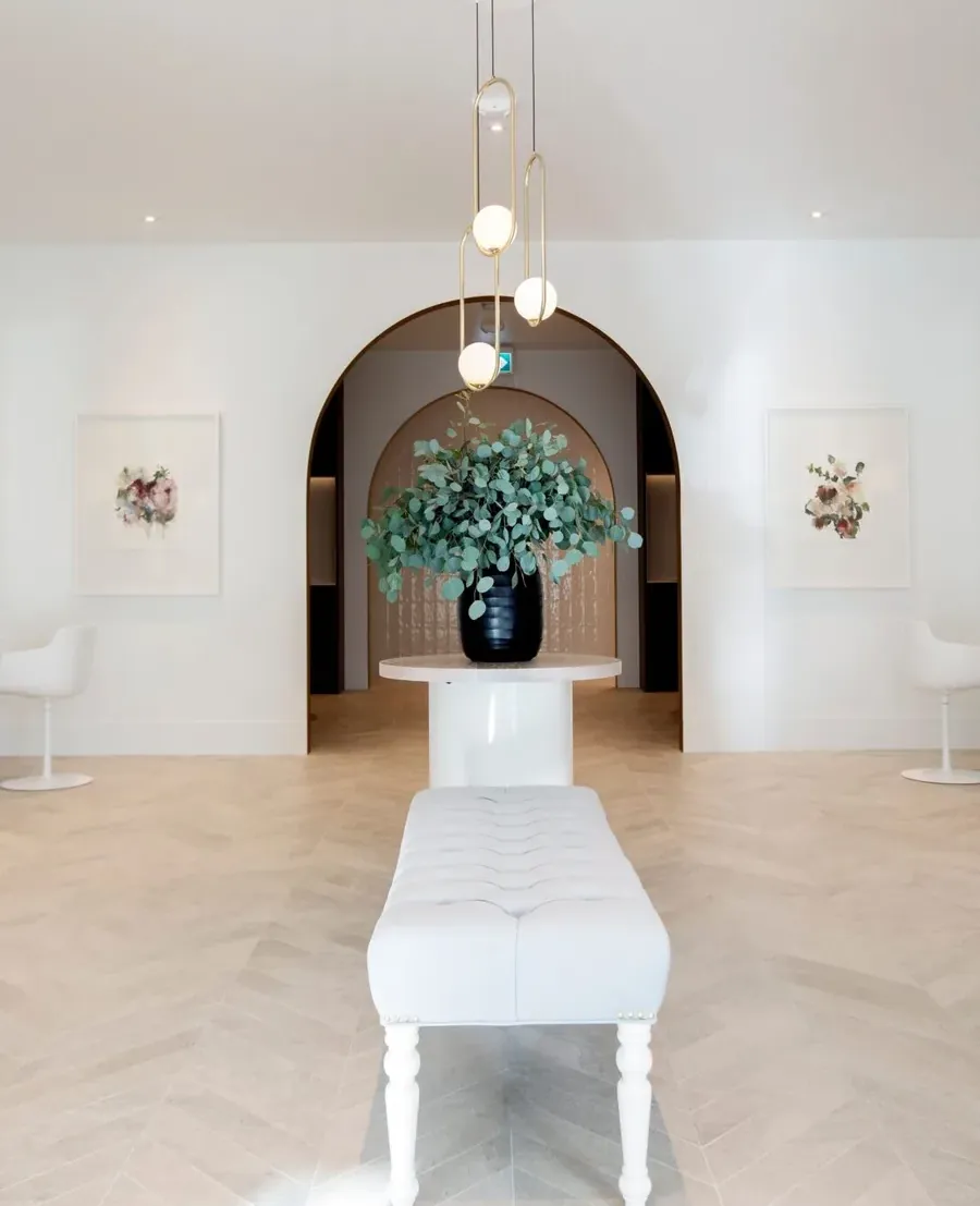 Elegant entrance to Wish Dry Bar showing arched doorway and luxury styling stations