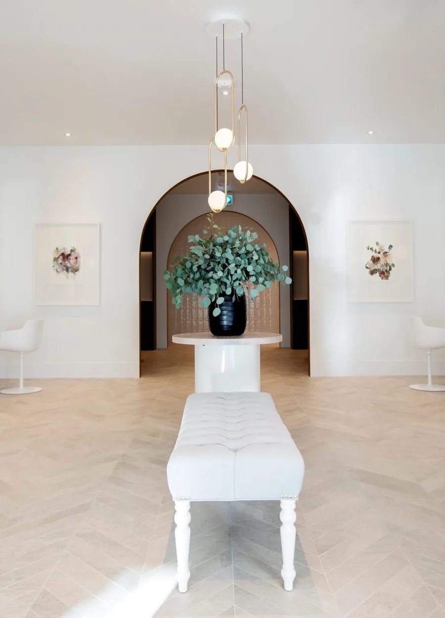 Elegant entrance to Wish Dry Bar showing arched doorway and luxury styling stations