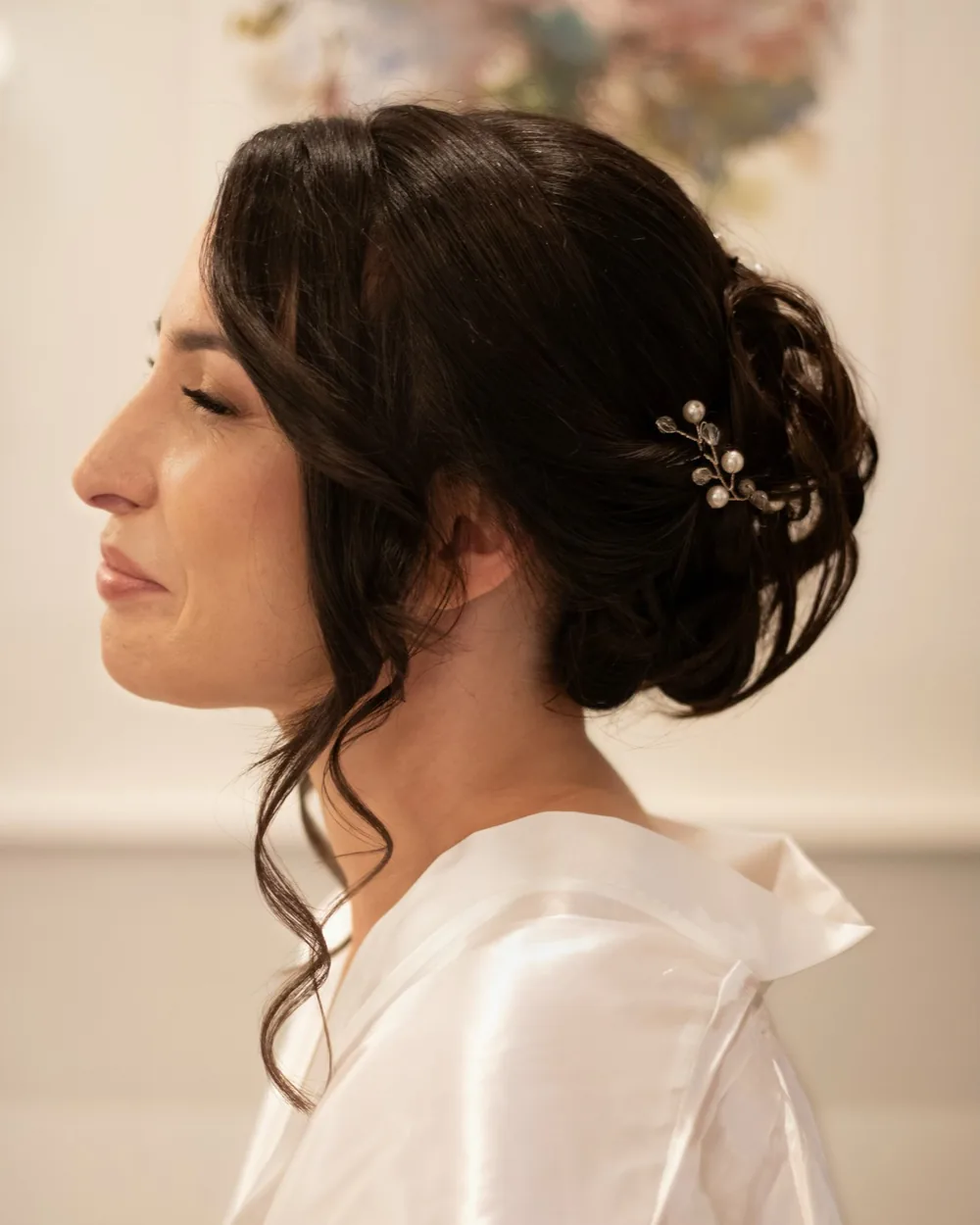 Elegant bridal updo with pearl accessories