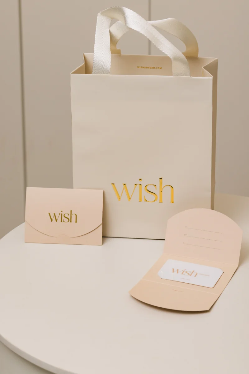 Wish Dry Bar gift card and branded gift bag at the Vancouver salon